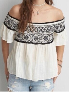 American Eagle cream with black embroidery baby doll or off shoulders top